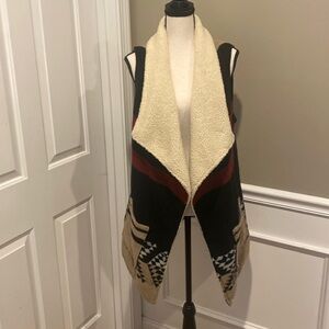 Like new long cozy size small wool like vest.